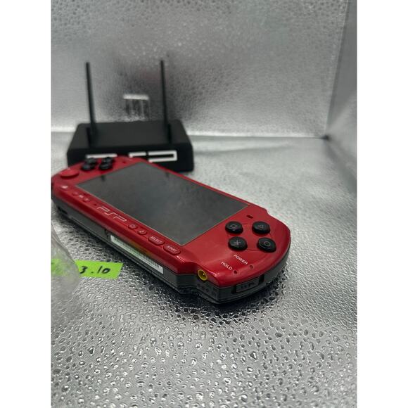 Red and black psp 3000 w/charger & new battery - Picture 6 of 7